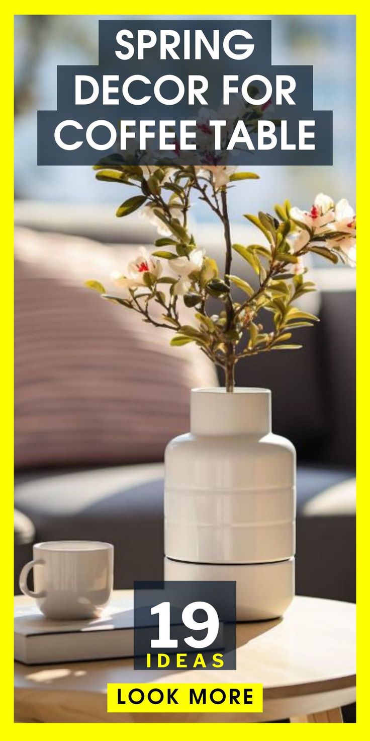 a white vase with flowers sitting on top of a table next to a cup and saucer