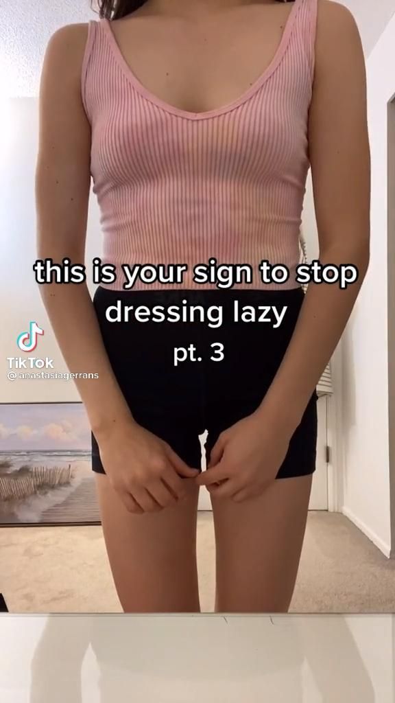 a woman standing in front of a mirror with her hands on her hips and the words, this is your sign to stop dressing lazy pt 3