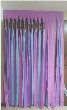 purple and blue curtains hanging on the wall