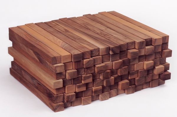 several pieces of wood stacked on top of each other in the shape of cubes