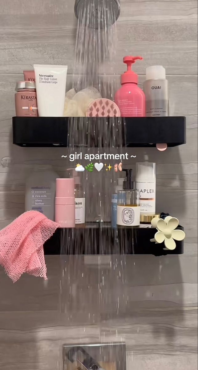 the shower head is connected to two shelves with soap, shampoos and other items