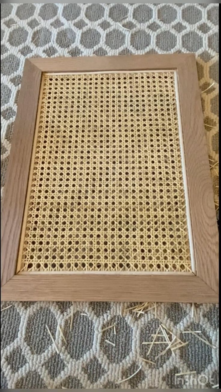 a wooden frame sitting on top of a bed
