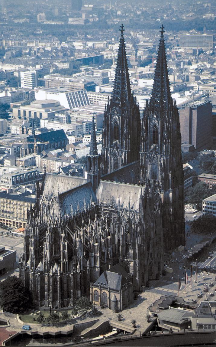 an aerial view of a large cathedral in the city