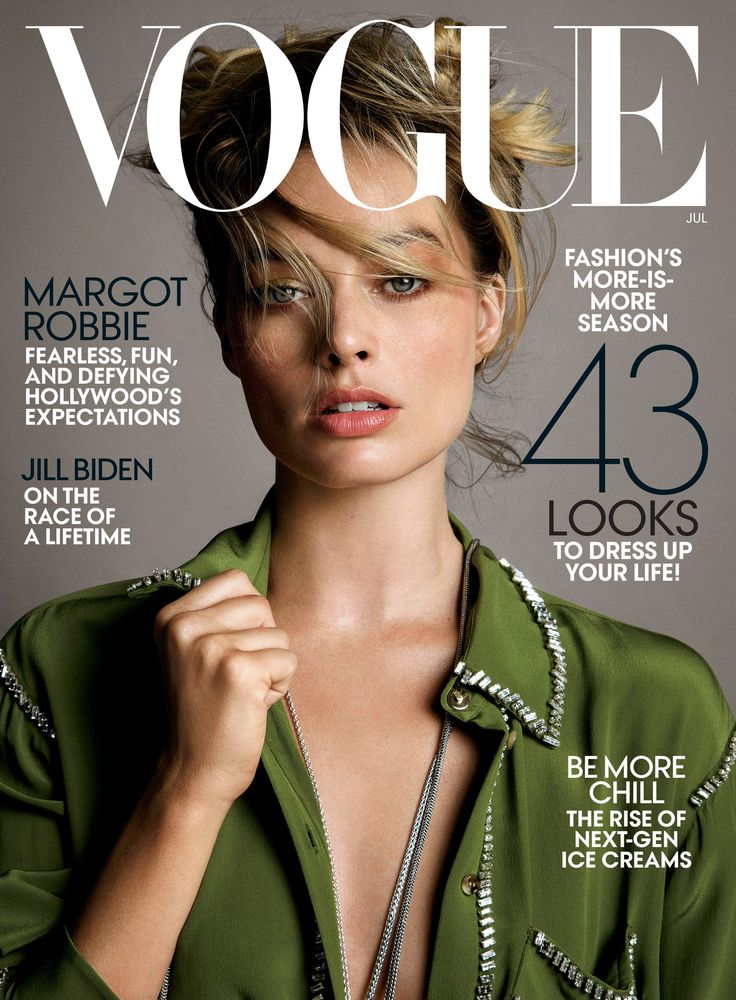 a woman in a green shirt is featured on the cover of a magazine, wearing jewelry