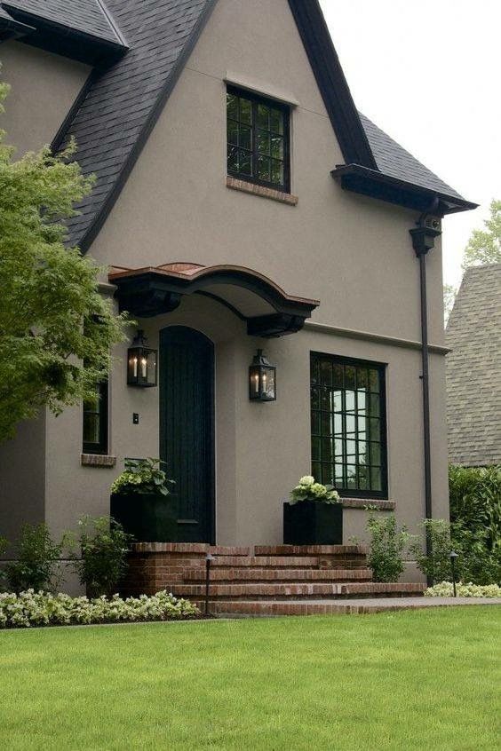 a gray house with black trim and windows