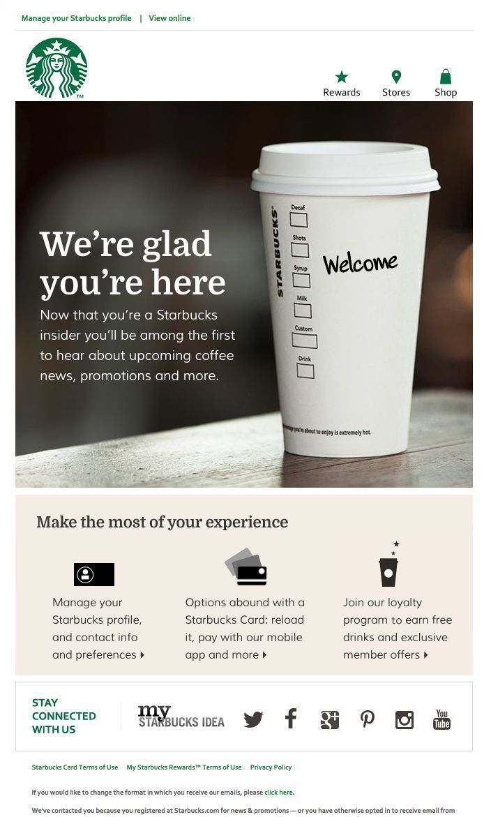 the starbucks coffee shop website is displayed on a tabletop with an image of a cup