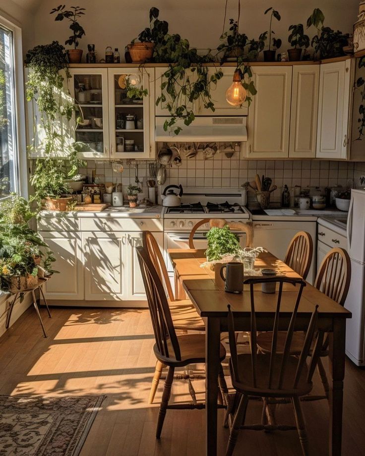 a kitchen filled with lots of wooden furniture and plants on the wall above the table