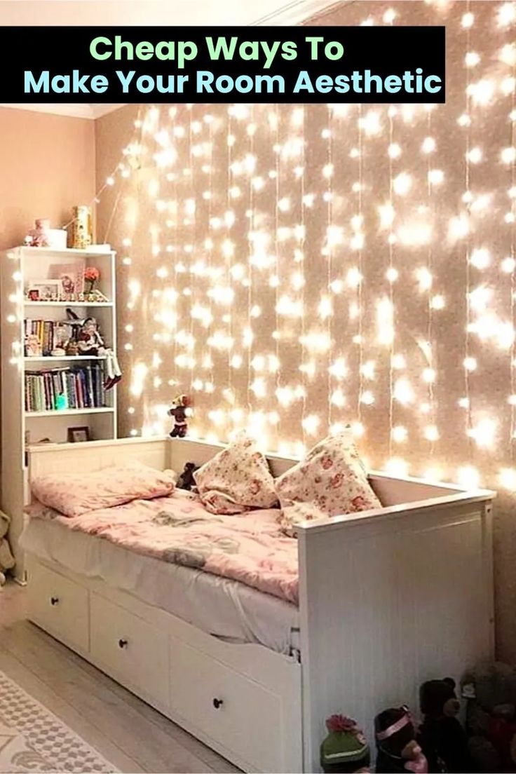 a bedroom with lights on the wall and a bed in front of a book shelf