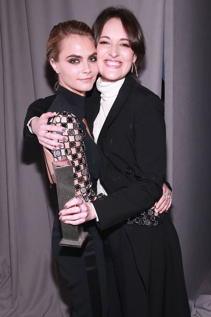 two women hugging each other at an event