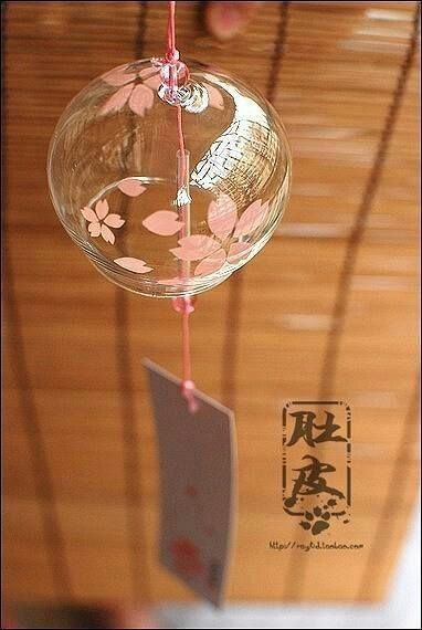 a glass ornament hanging from a wooden ceiling