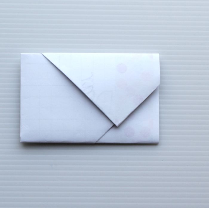 an origami envelope on a white background