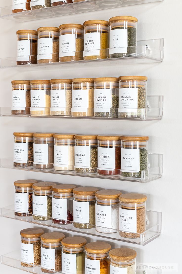 the shelves are filled with spices and seasonings