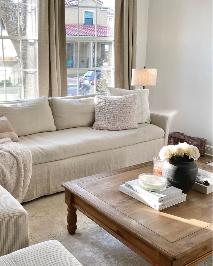 A sofa and coffee table with long curtains and a rustic coffee table Pottery Barn, Sofas, White Couch Living Room, Transitional Living Rooms, Square Living Room Table, Living Room No Coffee Table, Pottery Barn Furniture, Living Room Decor Neutral, Living Room Mantle