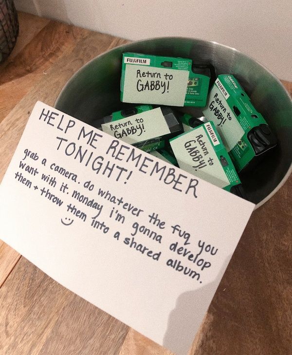 a bowl filled with lots of green batteries next to a sign that says help me remember tonight
