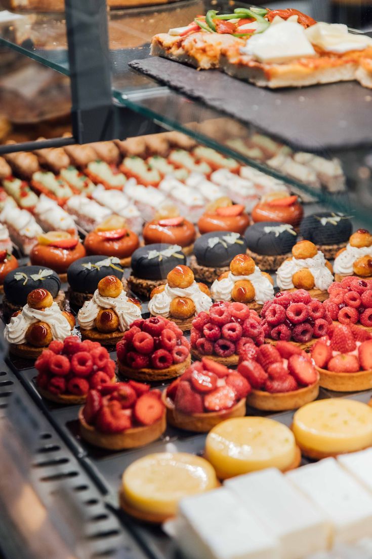 an assortment of pastries and desserts on display