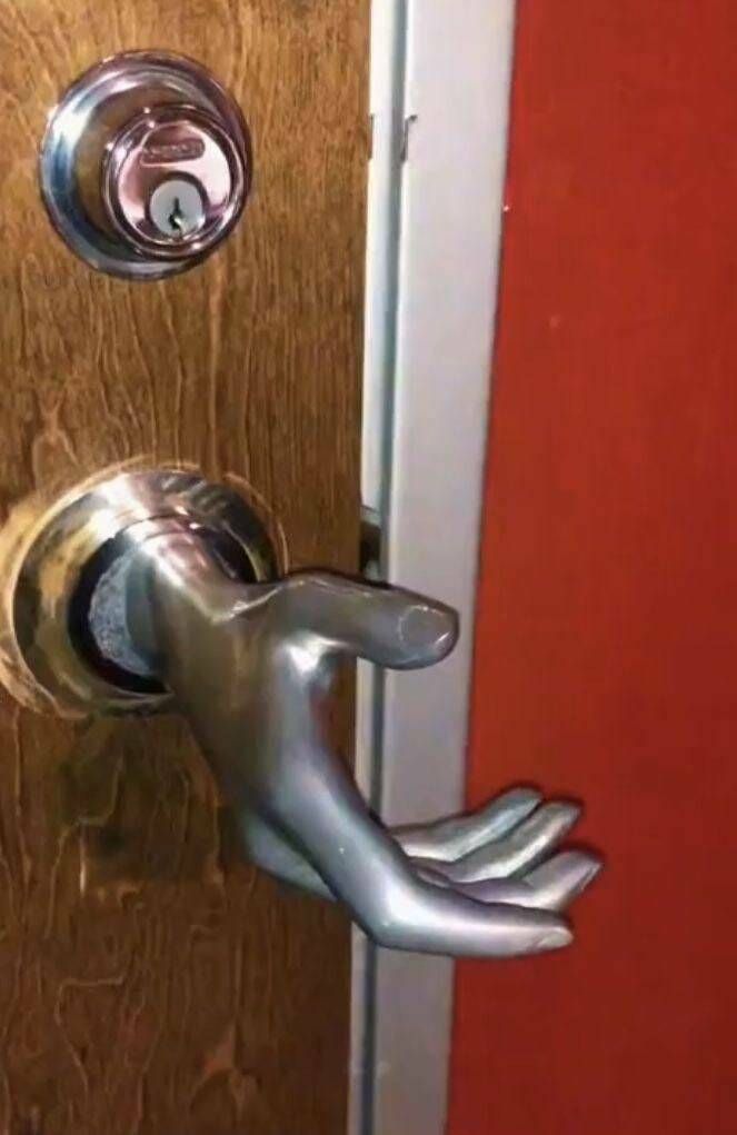 an open door with a metal handle on it
