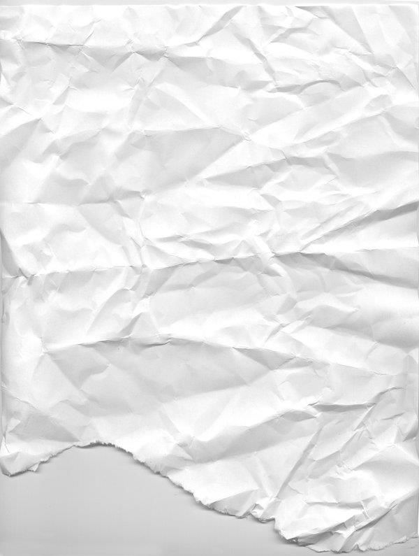 a piece of white paper that has been torn in half