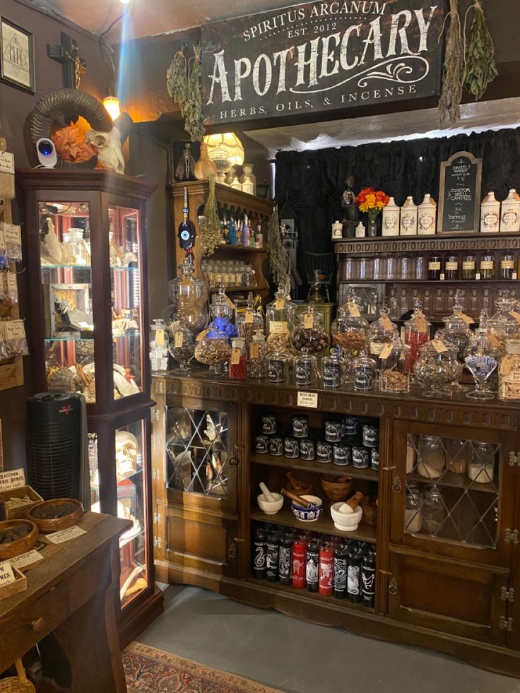 an antique pharmacy with many bottles and jars on the shelves in front of it's display case