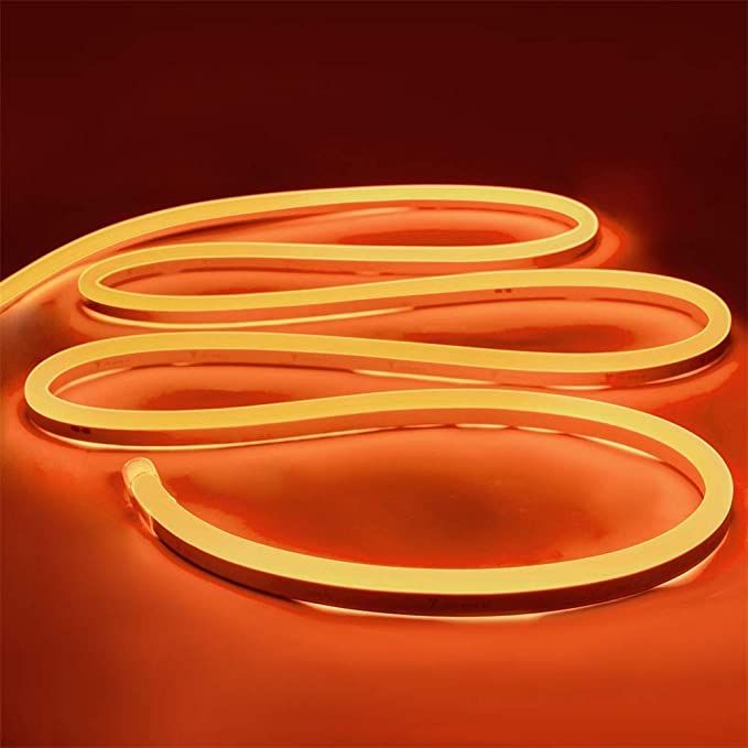 an orange neon sign on a red background with the letter s in it's center