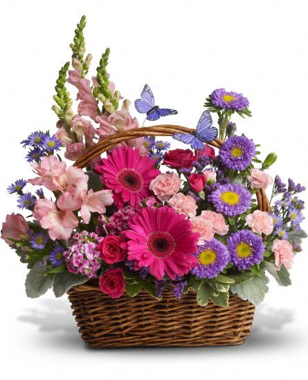 a basket filled with lots of colorful flowers