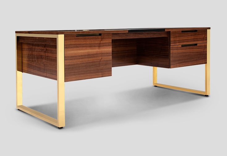 a wooden desk with gold legs and drawers