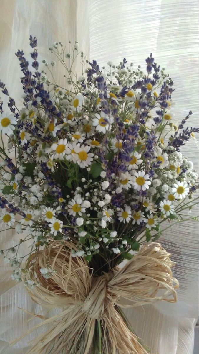 a bouquet of wildflowers tied to a burlock