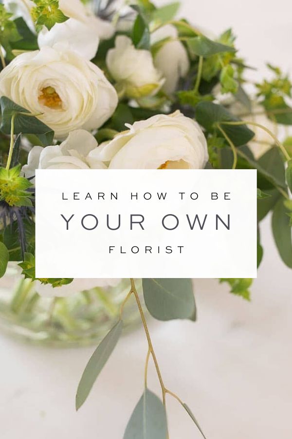 white flowers in a vase with the words learn how to be your own florist