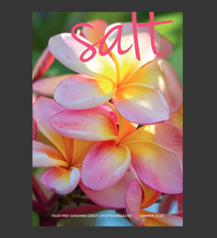 a pink and yellow flower with the word satt on it's front cover