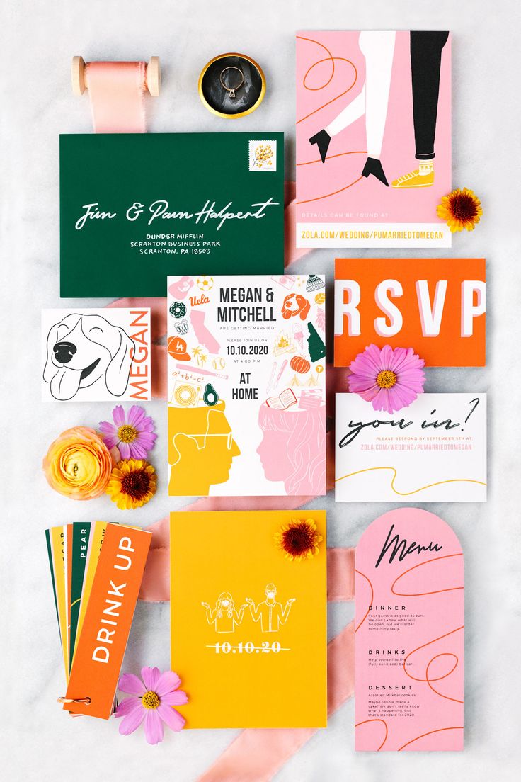 various wedding stationery items laid out on top of each other
