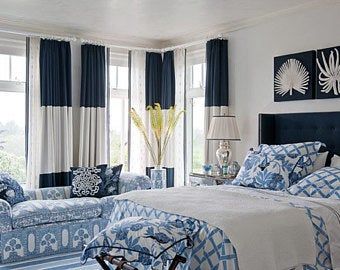 a bedroom with blue and white decor in it