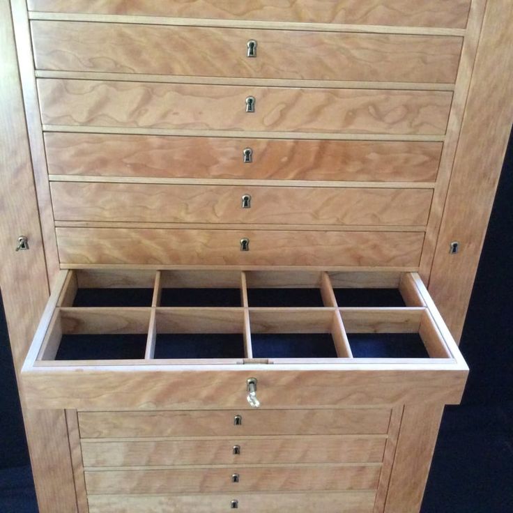 a large wooden dresser with drawers on it