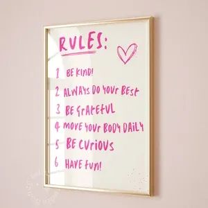 a whiteboard with rules written on it hanging on the wall next to a bed