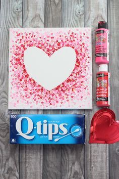 valentine's day crafting supplies including candy, glue and paper hearts
