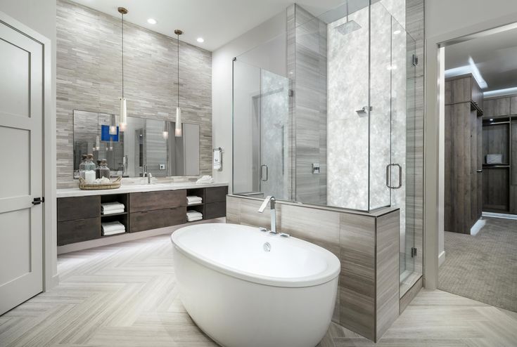 a bathroom with a large bathtub next to a walk in shower