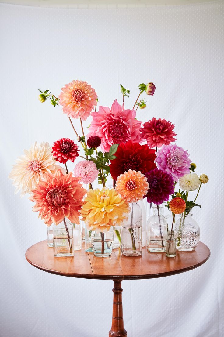 an instagram page with flowers in vases on the table