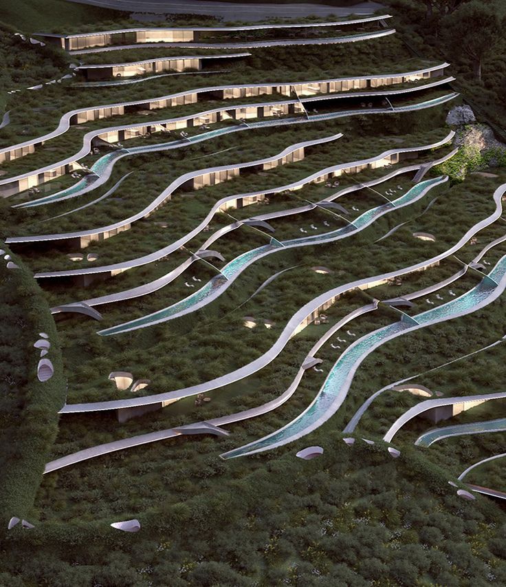 an aerial view of a hillside with many ramps and water slides in the foreground