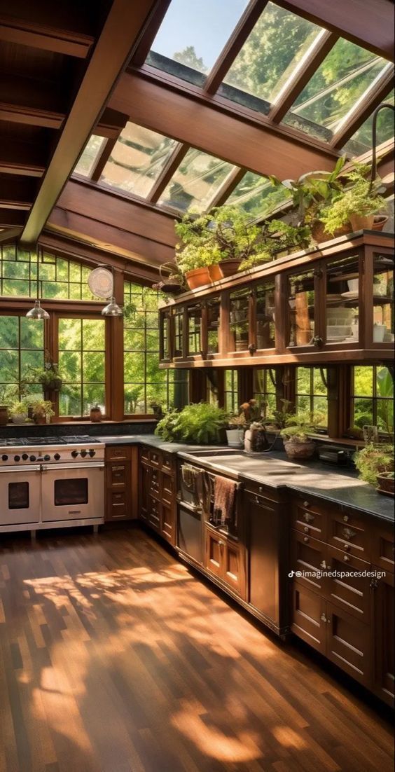 a kitchen with wooden floors and lots of plants in the window sill over the stove