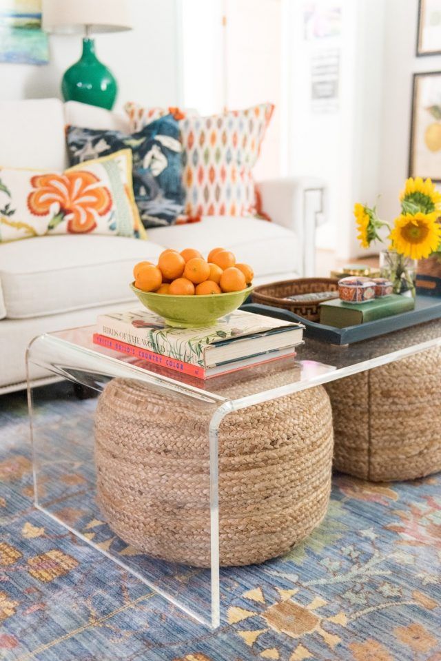 a coffee table with oranges on top of it
