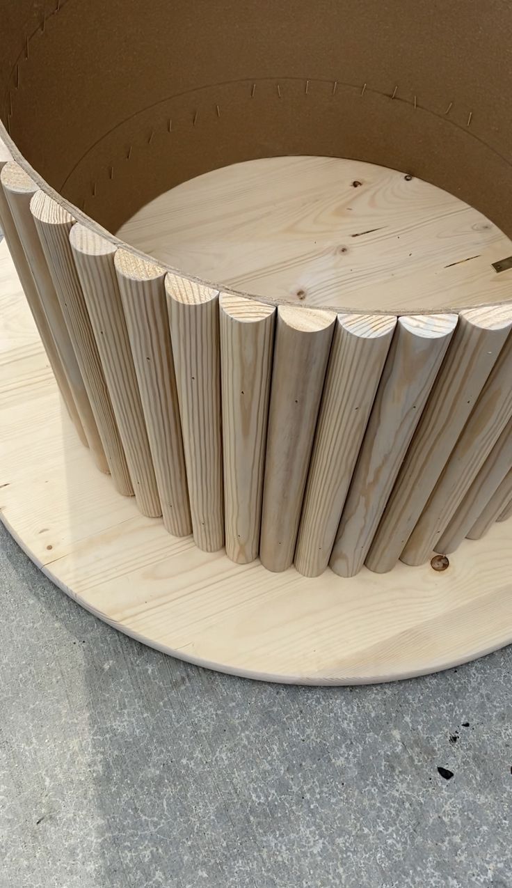 a circular wooden object sitting on top of a table