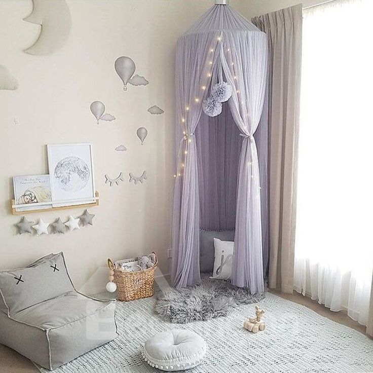 a child's bedroom decorated in pastel colors