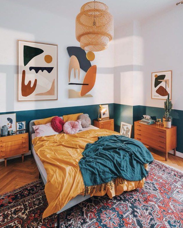 a bed sitting in a bedroom on top of a rug