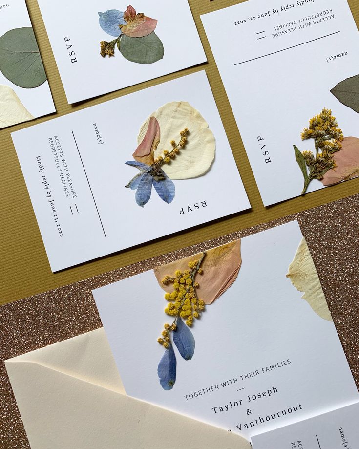 wedding stationery with pressed flowers and leaves