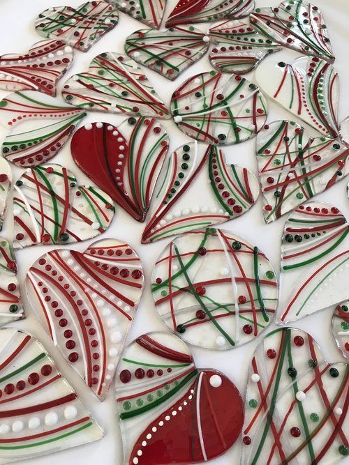 some red and green decorated cookies on a white plate
