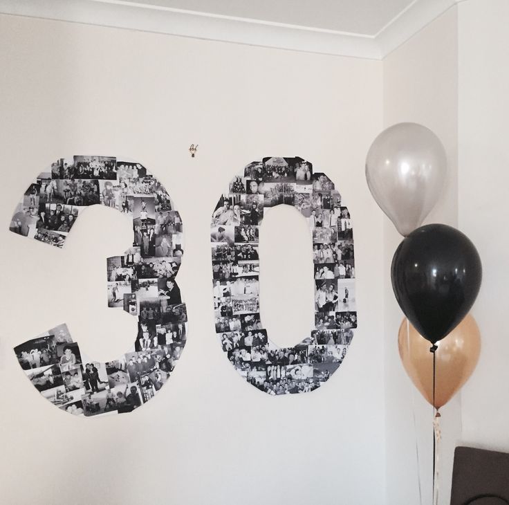 the number 50 is made out of photos and balloons in front of a white wall