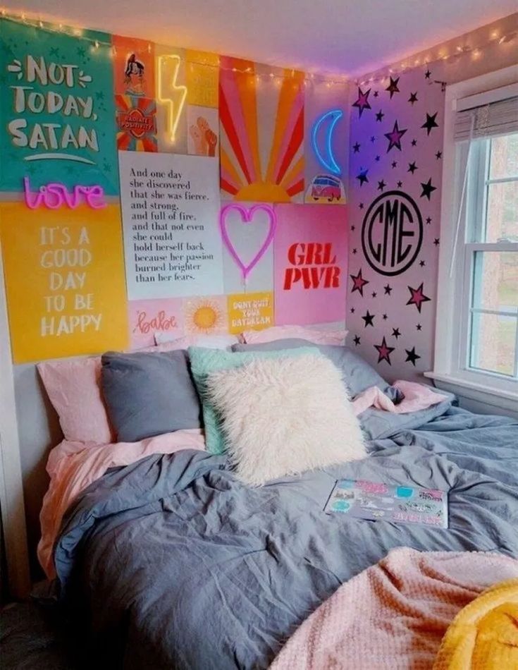 a bedroom with colorful lights and posters on the wall