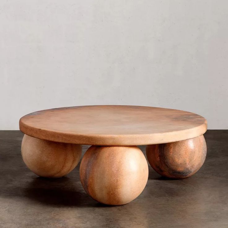 a wooden table sitting on top of a cement floor