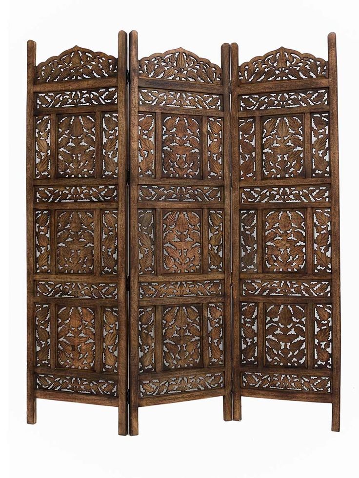 an old wooden screen with intricate carvings on the front and back panels, set against a white background
