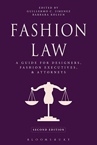 the cover of fashion law, with an image of a statue holding scales on it