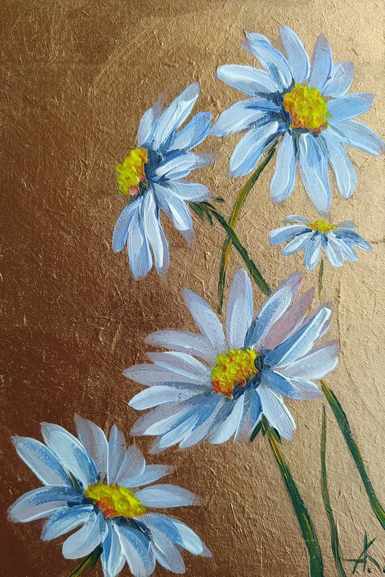 three blue daisies in a vase on a brown background