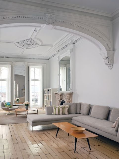 a living room filled with furniture and white walls